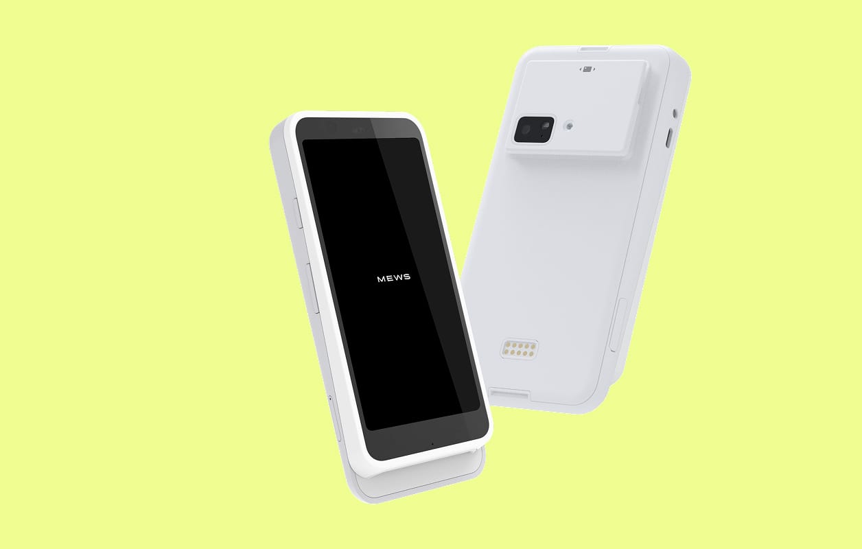 White smart POS device with a black touchscreen displaying "MEWS" on a light yellow background.